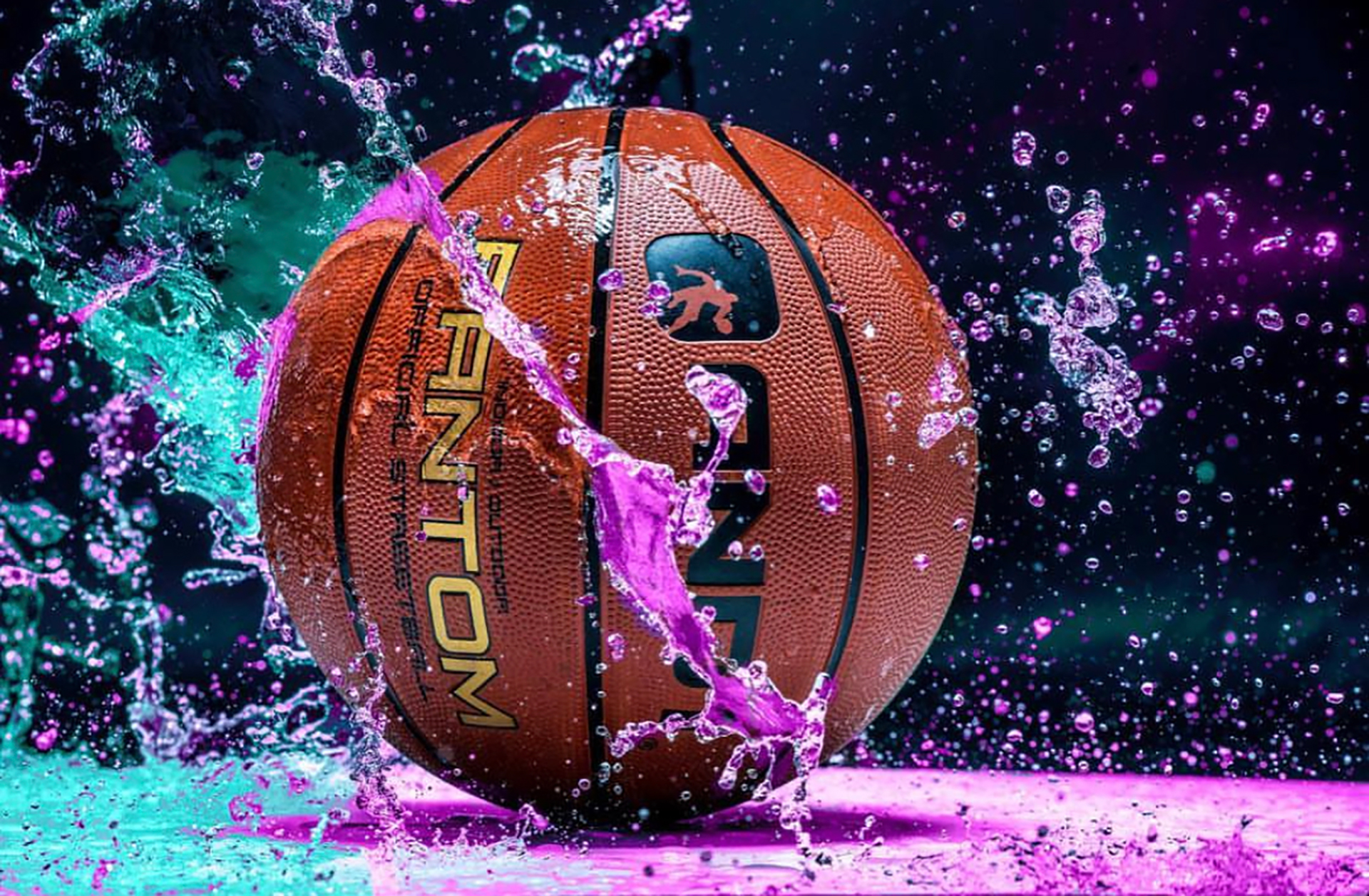 Houston commercial photographer, sports product photography with basketball and water splash, high-impact advertising image.